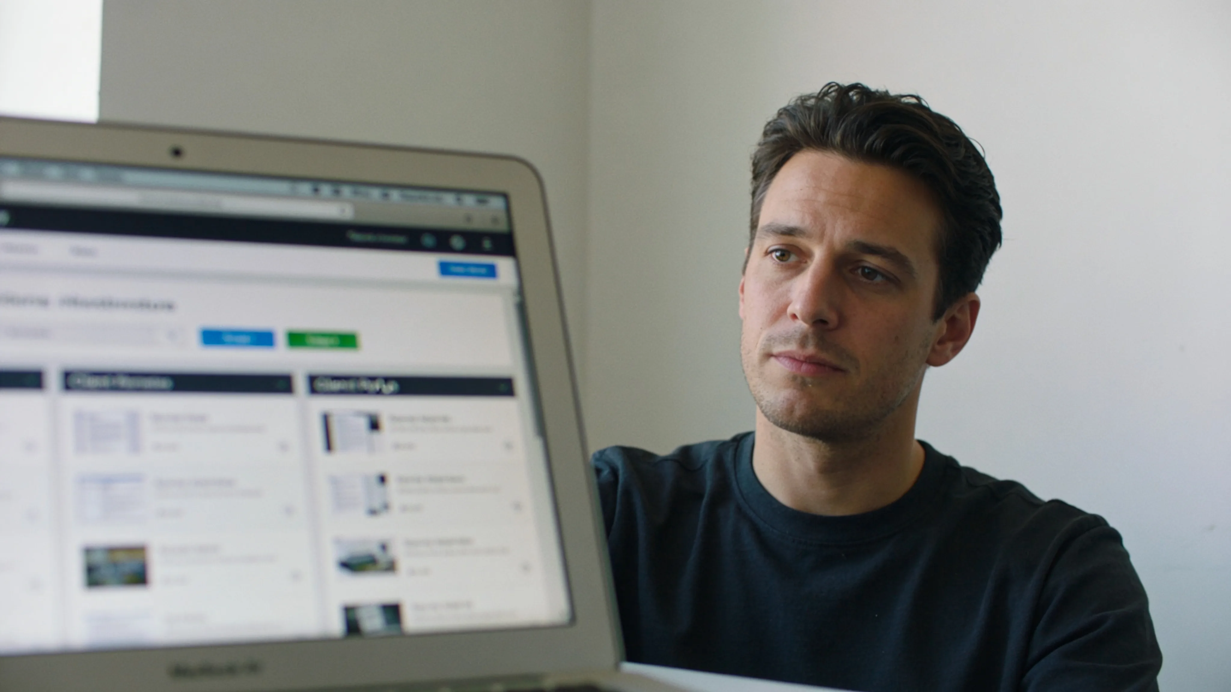 Consultant reviewing project status updates inside a clean client portal dashboard